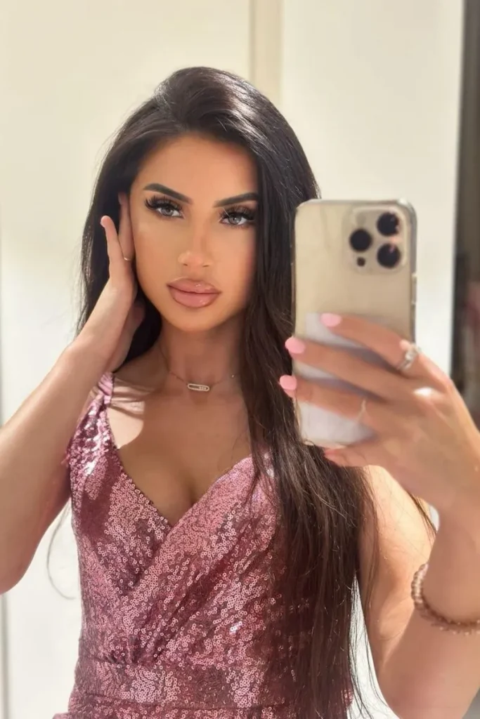 Linda takes a picture in the mirror before going out for a walk