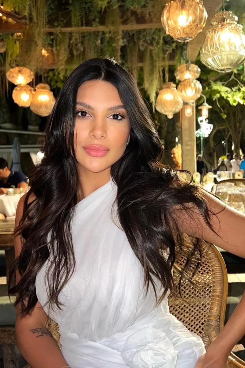 Kath exuding confidence and sophistication with a graceful pose